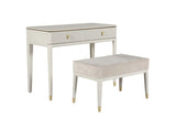 White desk with gold accents and matching bench on a white background